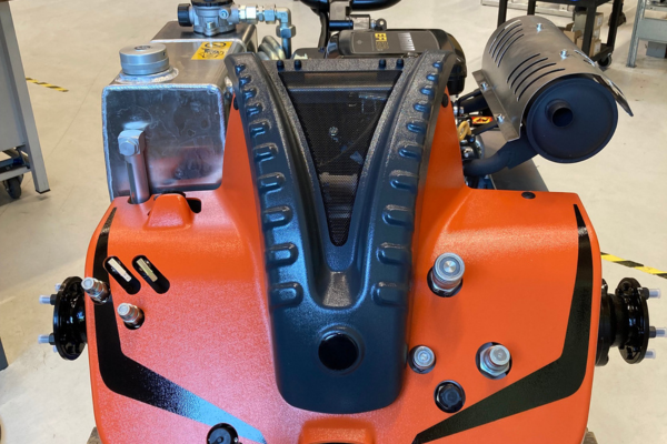 industrial pump, engineered equipment, orange machine, metal fittings, control panel